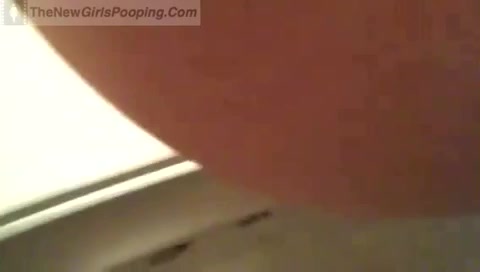 Click to play video Woman pooping in toilet - video 4