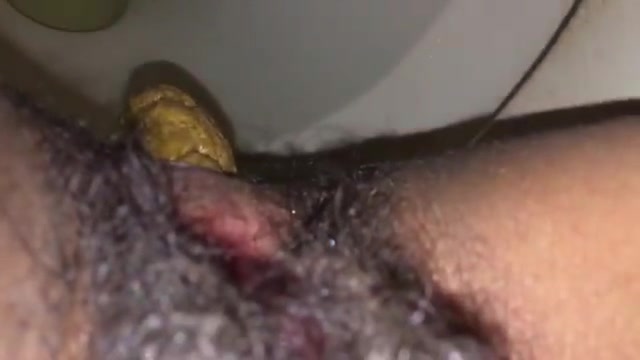 Click to play video Nice closeup of girl's delicious poop and hairy cunt