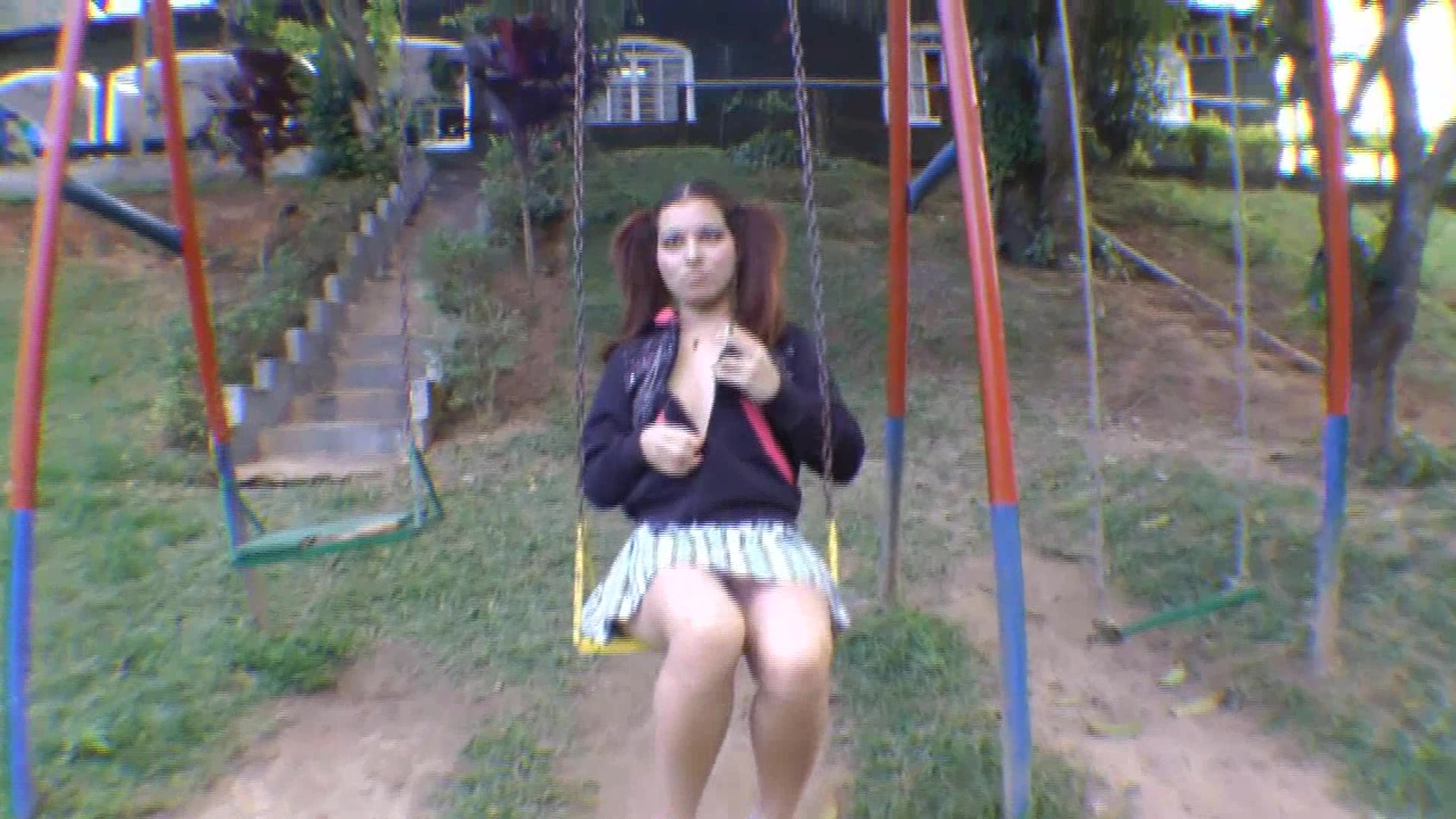 Click to play video Cutie in Pigtails poops on a swing
