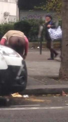 Click to play video Black woman shitting on the street and she doesn't care