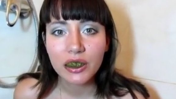 Click to play video Cutie eating her own shit