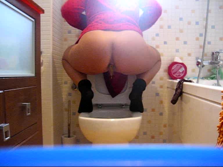 Click to play video Milf squats over toilet and poops for us