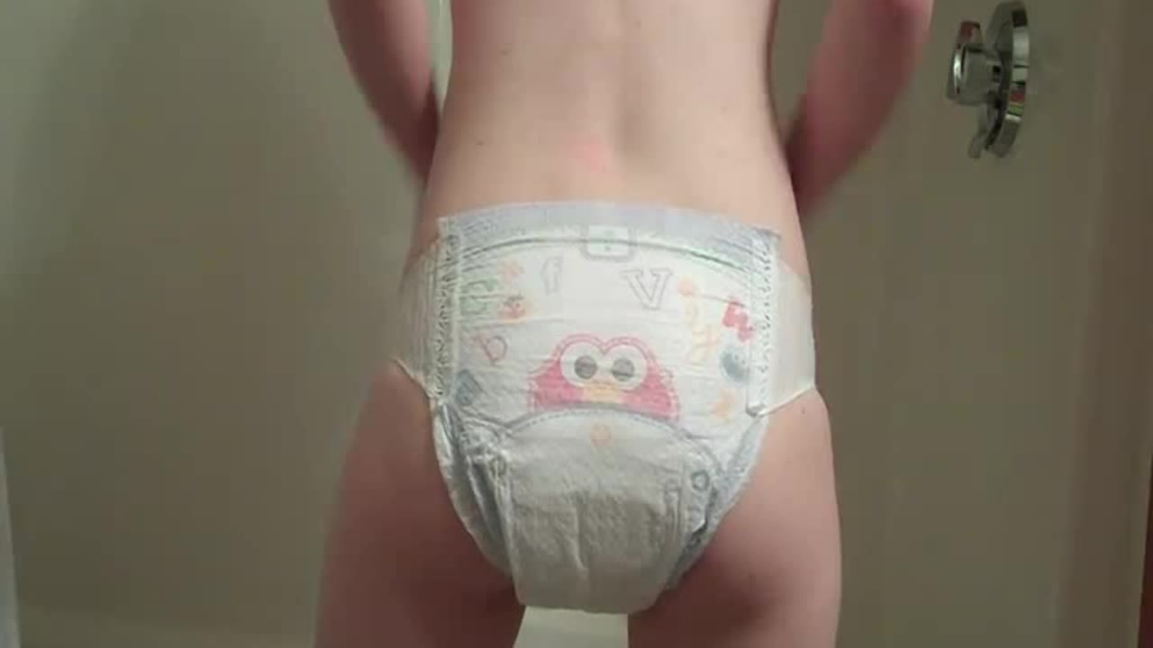 Click to play video Girl Releases Soft Mush Into Her Elmo Diaper. 