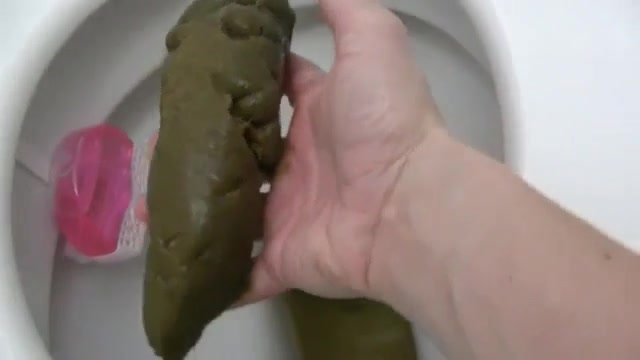 Click to play video Dropping a big turd while fingering her cunt